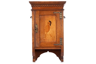 Lot 56 - An Arts & Crafts style mahogany hanging cabinet
