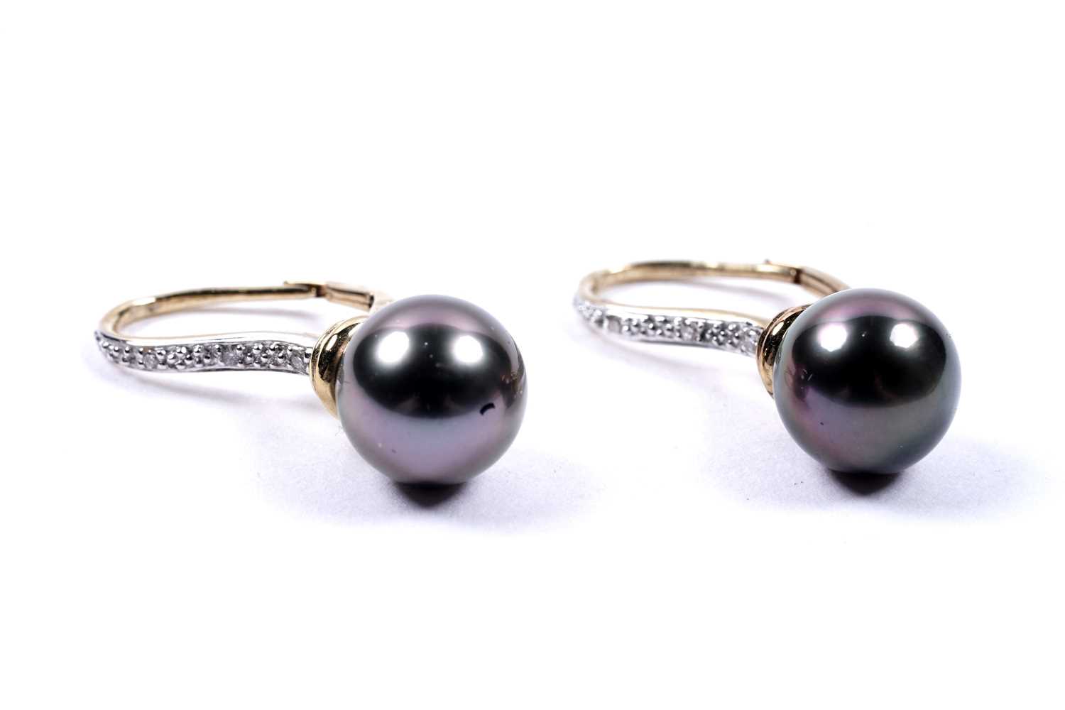 Lot 83 - A pair of black cultured pearl and diamond earrings