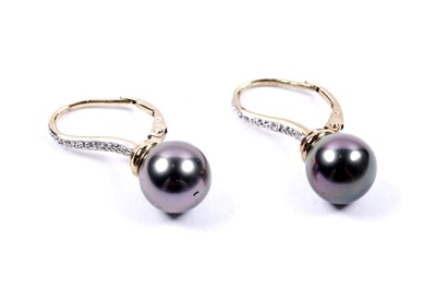 Lot 83 - A pair of black cultured pearl and diamond earrings