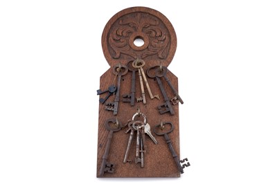 Lot 465 - Two carved panels and a selection of keys
