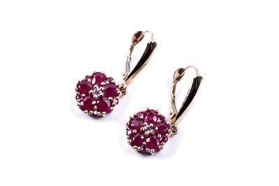 Lot 58 - A pair of ruby flowerhead pattern earrings