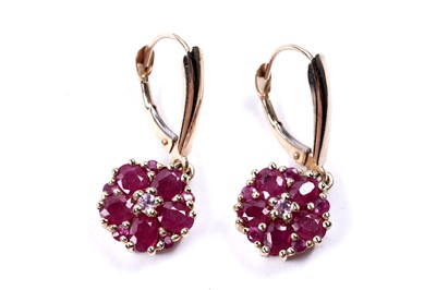 Lot 58 - A pair of ruby flowerhead pattern earrings