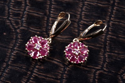 Lot 58 - A pair of ruby flowerhead pattern earrings