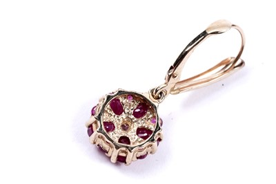 Lot 58 - A pair of ruby flowerhead pattern earrings