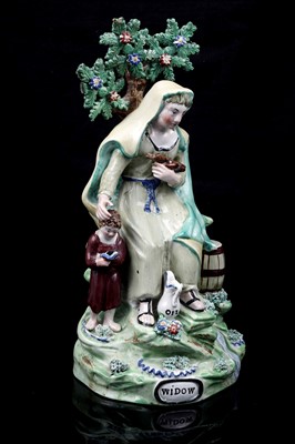 Lot 437 - A pair pearlware figures 'Elija' and 'Widow'