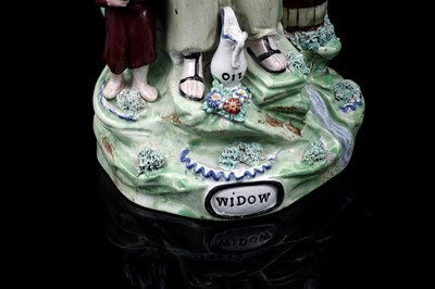 Lot 437 - A pair pearlware figures 'Elija' and 'Widow'