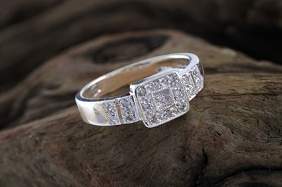 Lot 228 - A contemporary diamond ring of geometric design