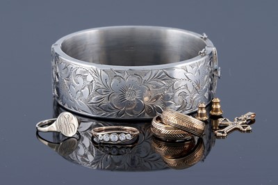 Lot 231 - Gold and silver jewellery including: a white sapphire ring; and a silver bangle