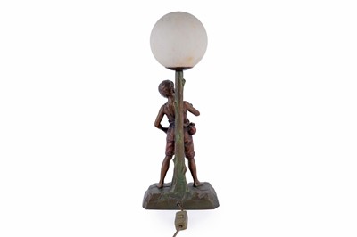 Lot 492 - An Art Deco bronzed metal table lamp with Peter Pan figure