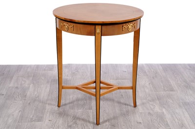 Lot 111 - A satinwood French empire-style occasional table