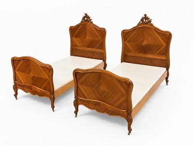 Lot 77 - A pair of French Rococo style walnut beds