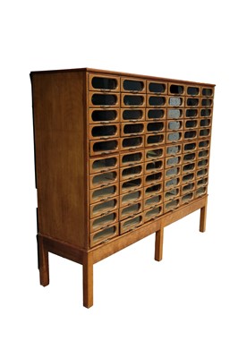 Lot 615 - An early 20th Century beech haberdashery cabinet
