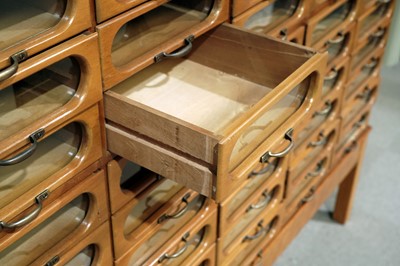 Lot 615 - An early 20th Century beech haberdashery cabinet