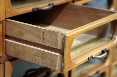 Lot 615 - An early 20th Century beech haberdashery cabinet