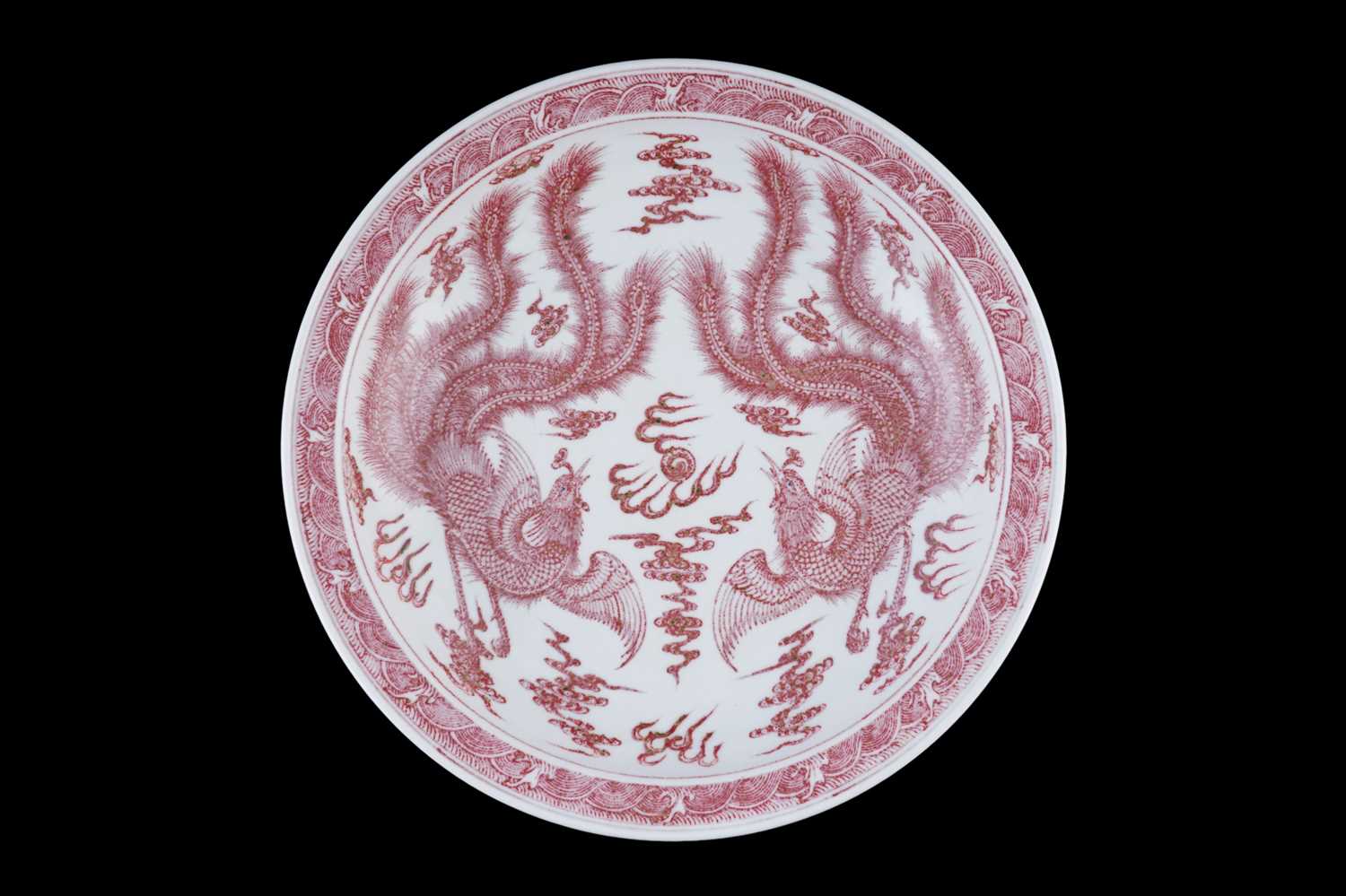 Lot 332 - A Chinese liver-red decorated charger