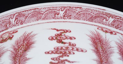 Lot 332 - A Chinese liver-red decorated charger