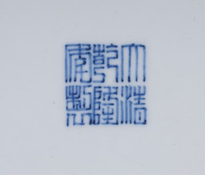Lot 332 - A Chinese liver-red decorated charger
