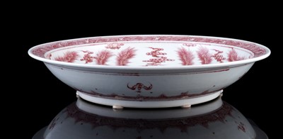 Lot 332 - A Chinese liver-red decorated charger