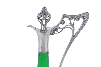 Lot 490 - WMF: and early 20th Century Art Nouveau pewter and green glass claret jug