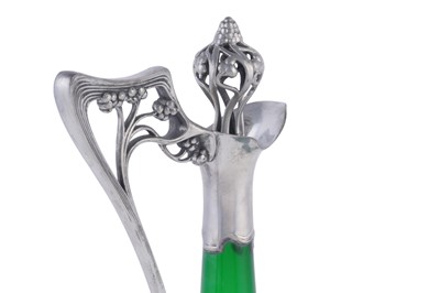 Lot 490 - WMF: and early 20th Century Art Nouveau pewter and green glass claret jug