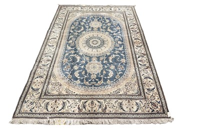 Lot 565 - A hand-knotted silk Persian Nain carpet