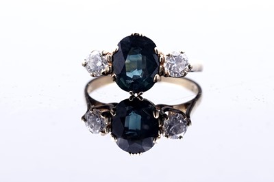 Lot 244 - A 1970s Edwardian Revival green sapphire and diamond ring