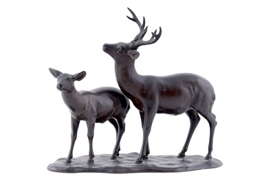 Lot 239 - An early 20th Century Oriental bronze figure group of a male and female deer