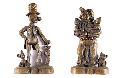 Lot 399 - A pair of cast brass doorstops