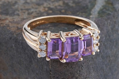 Lot 171 - A contemporary amethyst and diamond evening ring