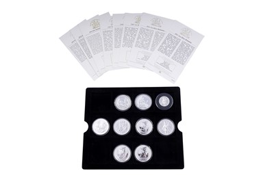 Lot 131 - Eight Queen Elizabeth II fine silver two-pound coins; and Royal Mint 2009 UK proof coin set
