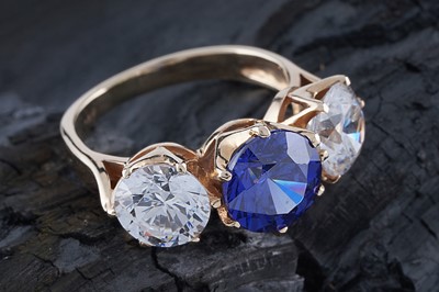 Lot 234 - A modern three-stone CZ dress ring
