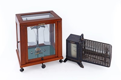 Lot 524 - A Negretti & Zambra thermos-hygrograph; and a mahogany cased set of chemist’s scales