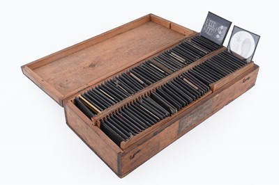 Lot 457 - A large collection of early 20th Century glass Magic Lantern slides; and a ‘Optiscope’ projector