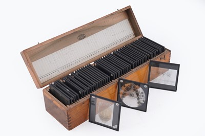 Lot 457 - A large collection of early 20th Century glass Magic Lantern slides; and a ‘Optiscope’ projector