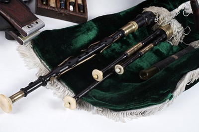 Lot 36 - A Reid Northumbrian small pipes; and a set of mahogany bellows with curved arms