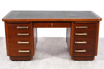 Lot 90 - A mid-Century oak pedestal desk