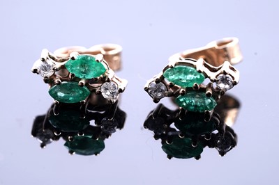 Lot 253 - A pair of emerald and diamond stud earrings