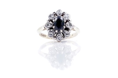 Lot 254 - An Edwardian style green tourmaline and diamond ring