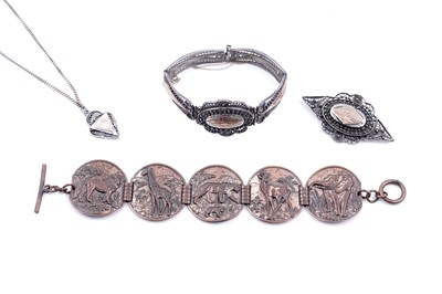 Lot 272 - An early 20th Century Middle Eastern Art Deco jewellery set; and an African savanna bracelet