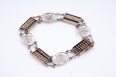 Lot 238 - A Chinese gold auspicious abacus pattern bracelet