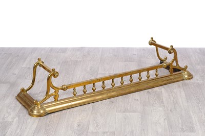 Lot 200 - A late 19th Century/early 20th Century brass fender