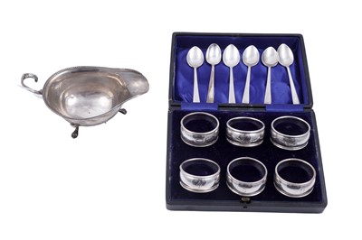Lot 335 - An Edwardian cased set of six silver napkin rings; and other items