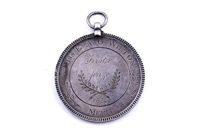 Lot 287 - A Georgian silver school prize medal