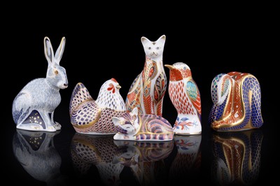 Lot 283 - Four boxed Royal Crown Derby paperweights; and two unboxed