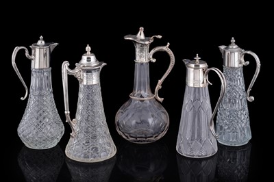 Lot 330 - A selection of five claret jugs