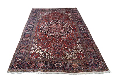 Lot 165 - A 20th Century hand-knotted woollen Heriz carpet