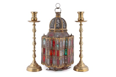 Lot 219 - A Moroccan floor lantern; and a pair of ecclesiastical turned candlesticks