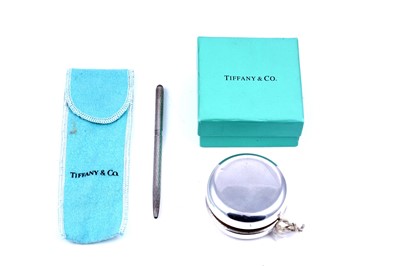 Lot 229 - A Tiffany & Co sterling silver yo-yo; and propelling pen