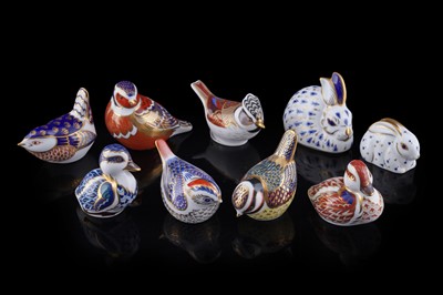 Lot 261 - A collection of nine Royal Crown Derby paperweights