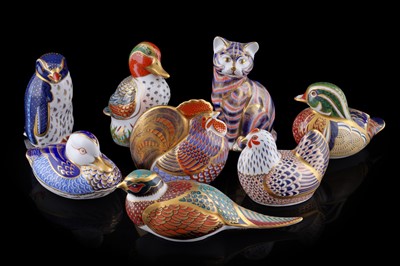 Lot 263 - A collection of eight Royal Crown Derby paperweights